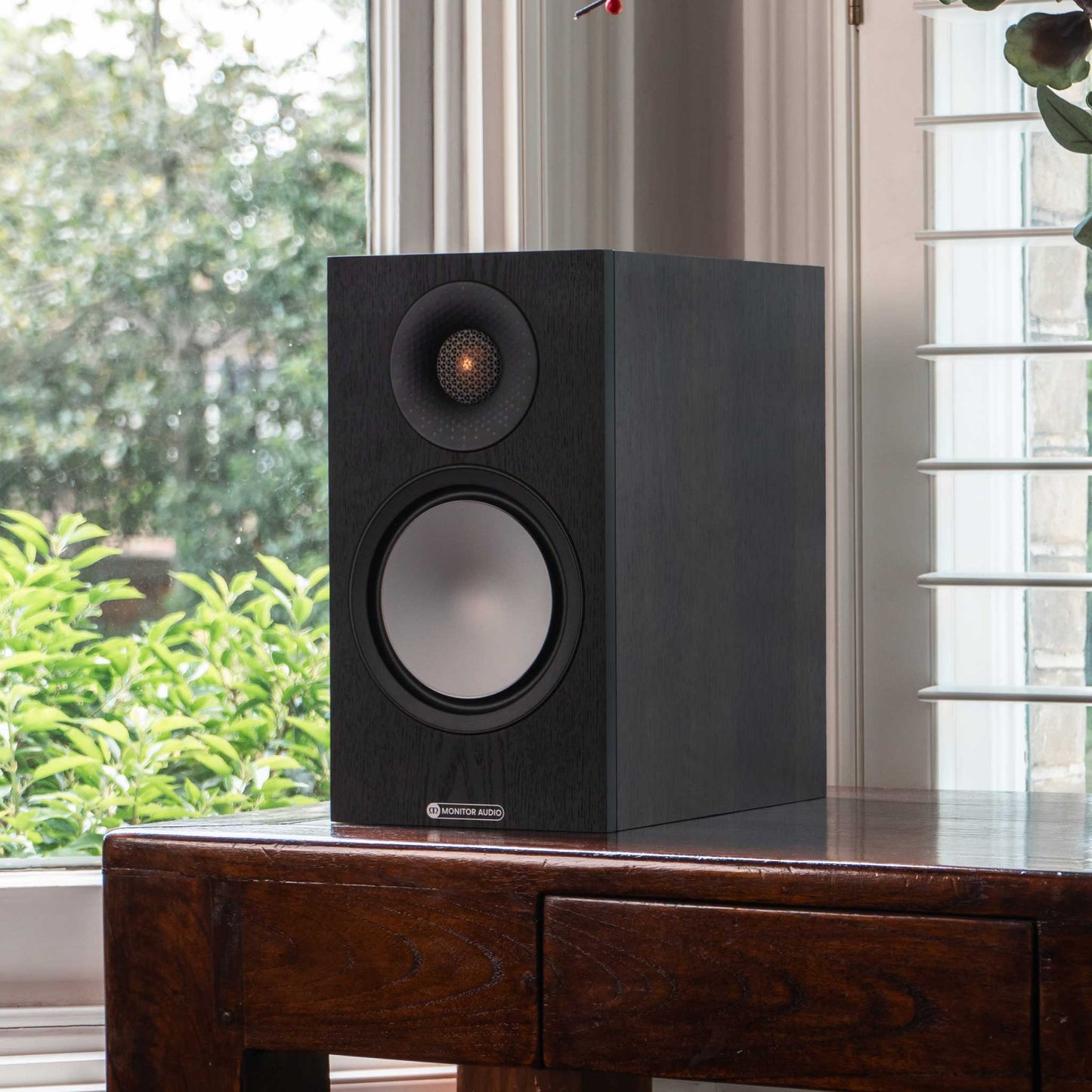 Monitor Audio Bronze 50 7G Walnut On Sideboard